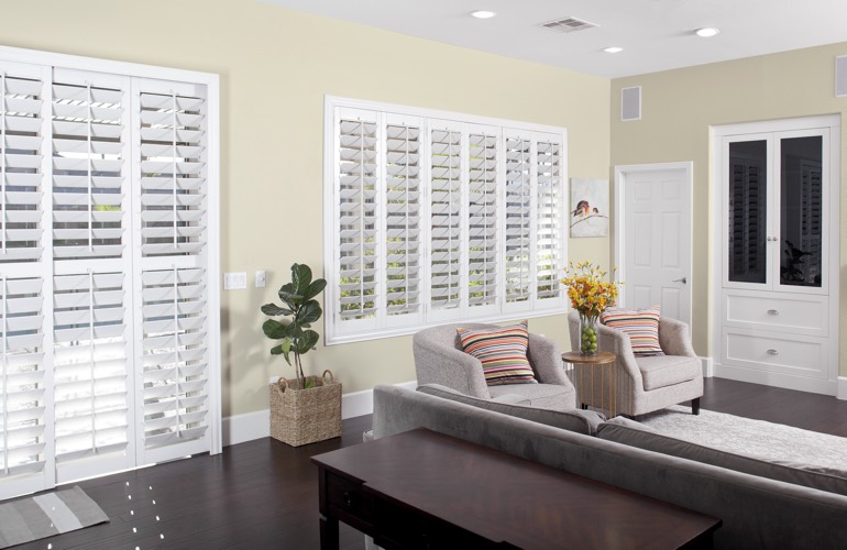 White plantation living room shutters